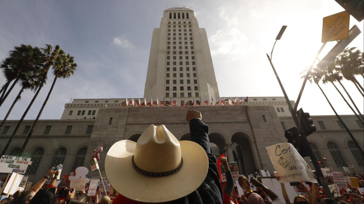 Striking teachers and supporters rallied Friday outside City Hall as talks were going on inside between union leaders and the Los Angeles Unified School District.