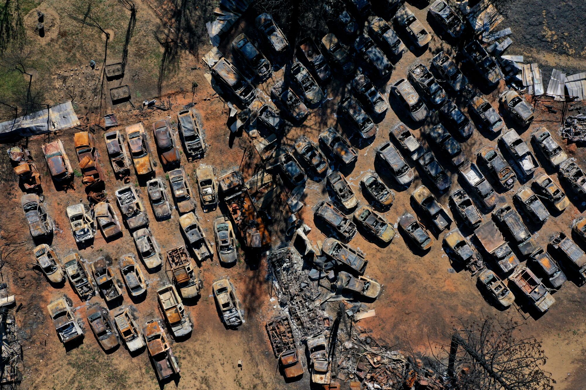 An aerial view of burnt cars