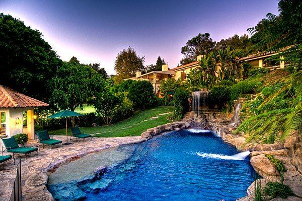 Among outdoor amenities is a grotto-style pool with waterfalls.