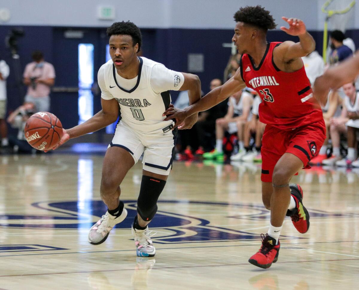 Sierra Canyon's Bronny James moves the ball up the court against Corona Centennial's Ramsey Huff.