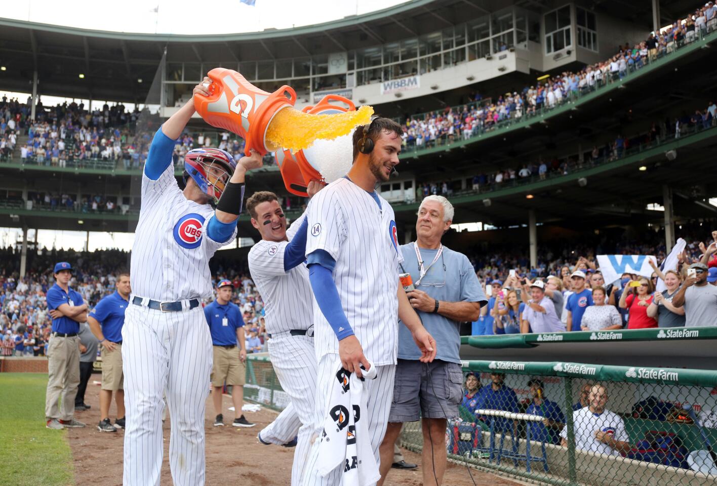 David Ross and Anthony Rizzo dunk Kris Bryant after his walk-off home run in the ninth inning.