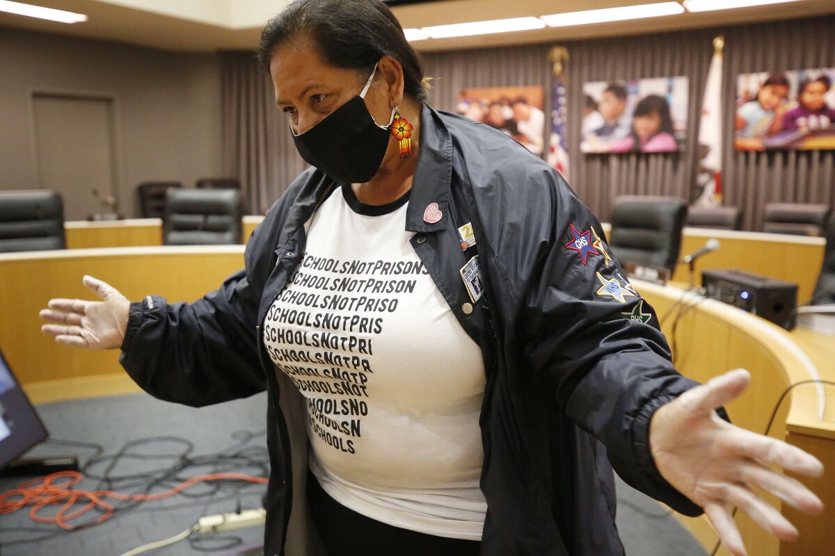 Los Angeles School Board member Monica Garcia wears a mask during a school board meeting.