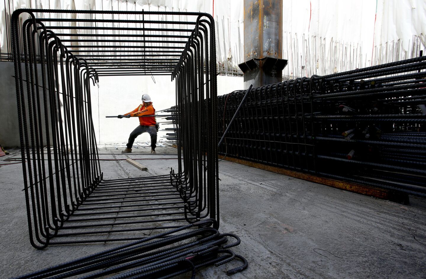 Ironworker Joel Ruvalcaba tightens up rebar during construction of the 73-story, 1,100-foot tall Wilshire Grand tower in downtown Los Angeles.