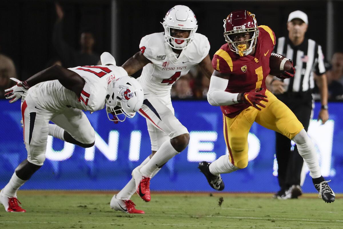 Velus Jones returns a kickoff against Fresno State at the Coliseum on Aug. 31, 2019.