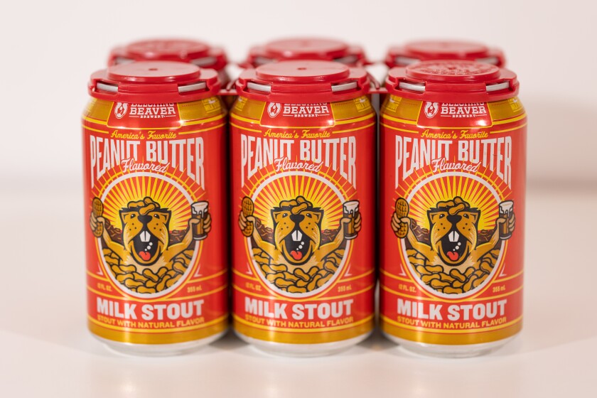 Belching Beaver's newly updated labels include the ones on the Peanut Butter Milk Stout cans.