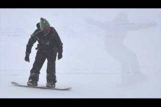 A Minute Away: Snow falling on skiers, Mammoth Mountain