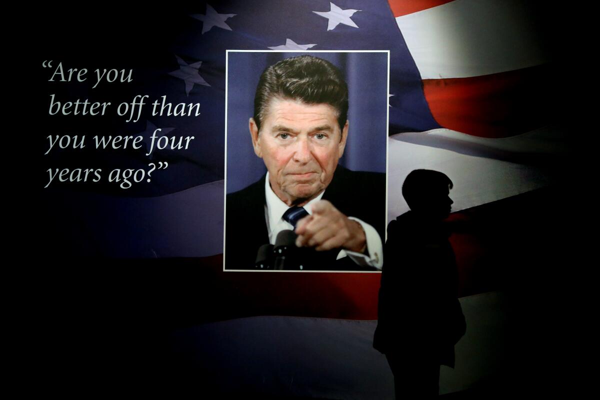 A portrait of President Reagan next to a quote on wall
