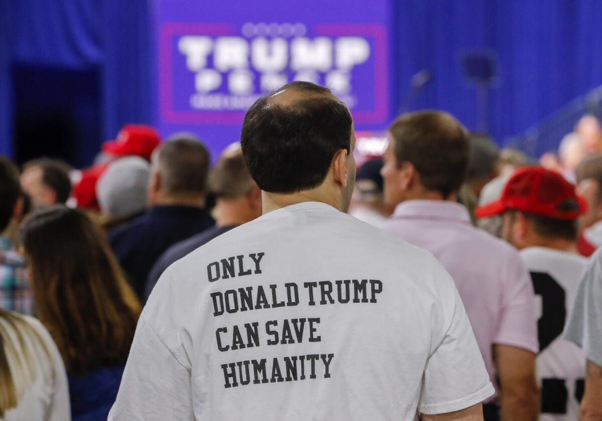 A supporter waits for Donald Trump to speak at a campaign rally in Charlotte, N.C., on Oct. 14, 2016.