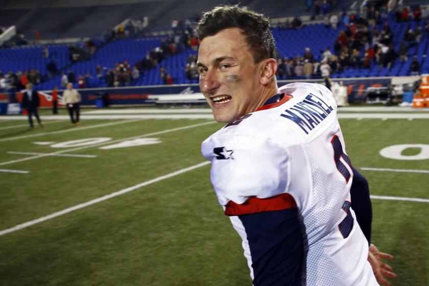 Memphis Express quarterback Johnny Manziel celebrates as he leaves the field after a Birmingham Iron at Memphis Express AAF football game, Sunday, March 24, 2019, at Liberty Bowl Memorial Stadium in Memphis, Tenn. against the Memphis won in overtime 31-25. (AP Photo/Wade Payne)
