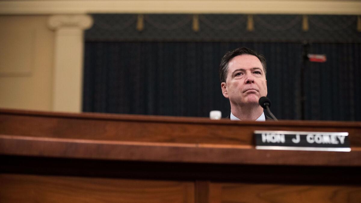 Then-FBI Director James Comey testifies to the House Intelligence Committee on March 20.