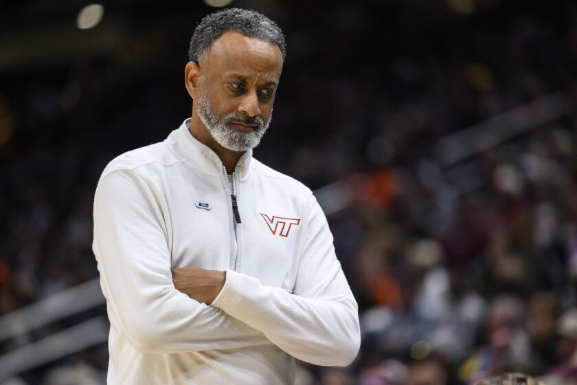 Virginia Tech head coach Kenny Brooks paces in front of his bench in the fourth quarter of a Sweet 16 college basketball game of the NCAA Tournament against Tennessee in Seattle, Saturday, March 25, 2023. (AP Photo/Caean Couto)