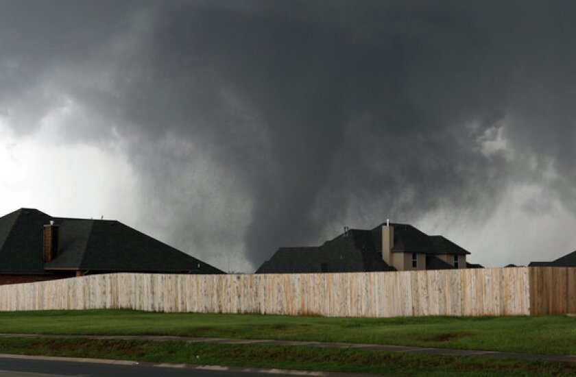 Massive tornado rakes Moore, Okla., on Monday.