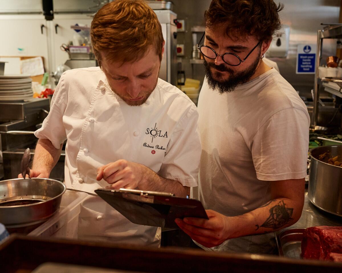 Sous chef Andy Parker and head chef Salvo Greco prepping food at SOLA, a restaurant in London