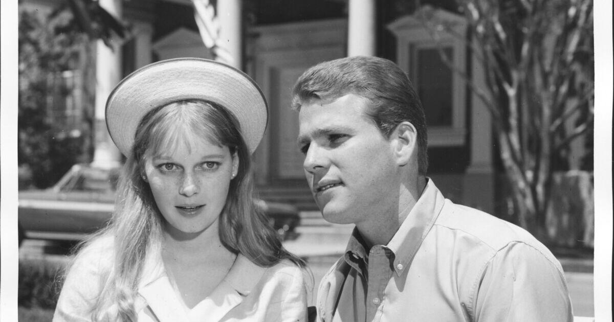 A young Mia Farrow and Ryan O'Neal on the set of "Peyton Place."