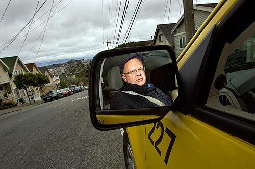 Paul Gillespie waits for a fare in San Francisco in his Ford Escape hybrid taxi. The city's first hybrid taxis -- all Escapes -- were introduced in 2005. Today, 14% of the city's 1,438 taxis are hybrids.