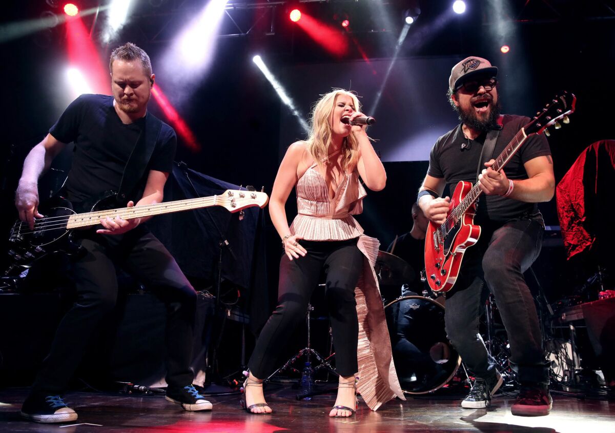Singer-songwriter Lauren Alaina (center) will perform at the San Diego County Fair on June 2. (Christopher Polk/Getty Images for ACM)