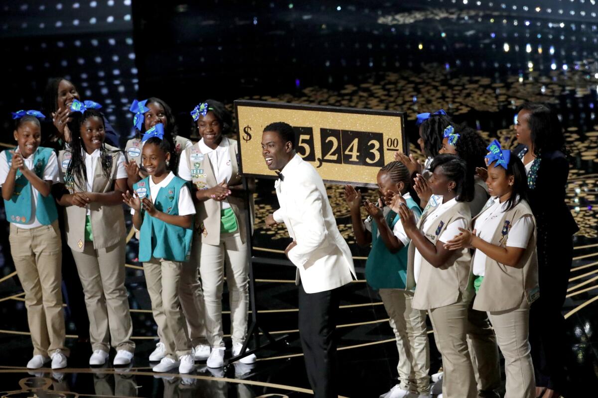 Chris Rock and Girl Scouts from Los Angeles during the telecast of the 88th Academy Awards at the Dolby Theatre.