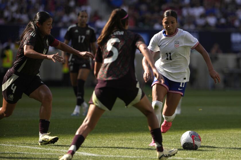 United States forward Sophia Smith, right, runs with the ball during the second half.