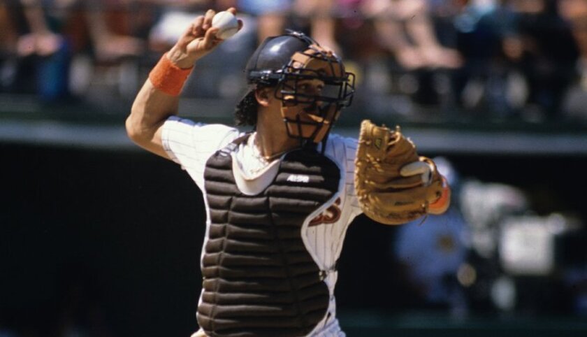 Padres catcher Benito Santiago makes a throw in 1992.