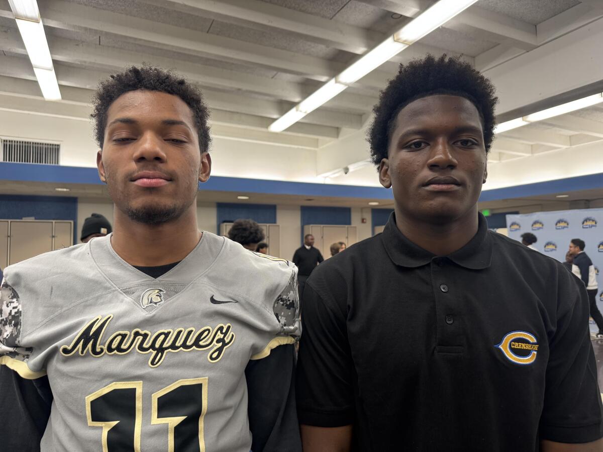 Junior linebackers Elyjah Staples (left) of Marquez and De'Andre Kirkpatrick of Crenshaw pose for a photo next to each other.