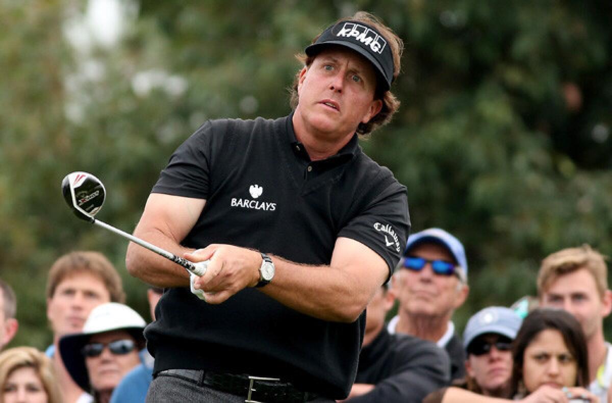 Phil Mickelson watches his tee shot on the 18th hole during the second round of the Farmers Insurance Open at Torrey Pines on Friday.