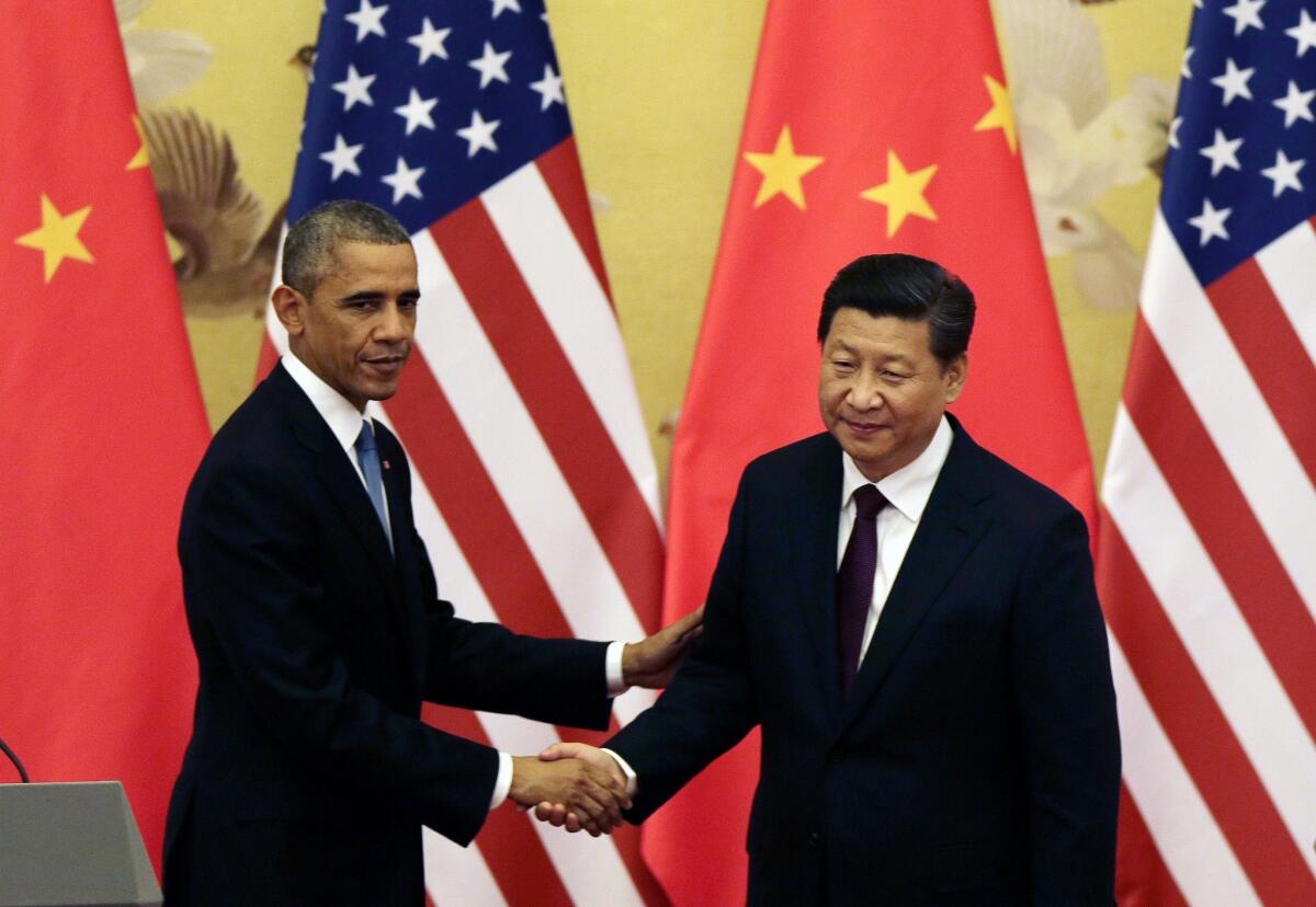 President Obama shakes hands with his Chinese President Xi Jinping after a news conference in Beijing in November 2014. Xi is scheduled to visit the White House this week.