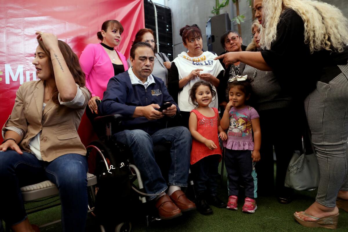 At a women's forum in Tijuana, Julian Leyzaola, the Democratic Revolution Party candidate for mayor, is approached by a woman claiming the photo on her cellphone is of Leyzaola's nephew.