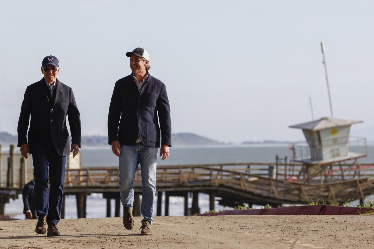 President Biden and Gov. Gavin Newsom on the beach in Seacliff, Calif.