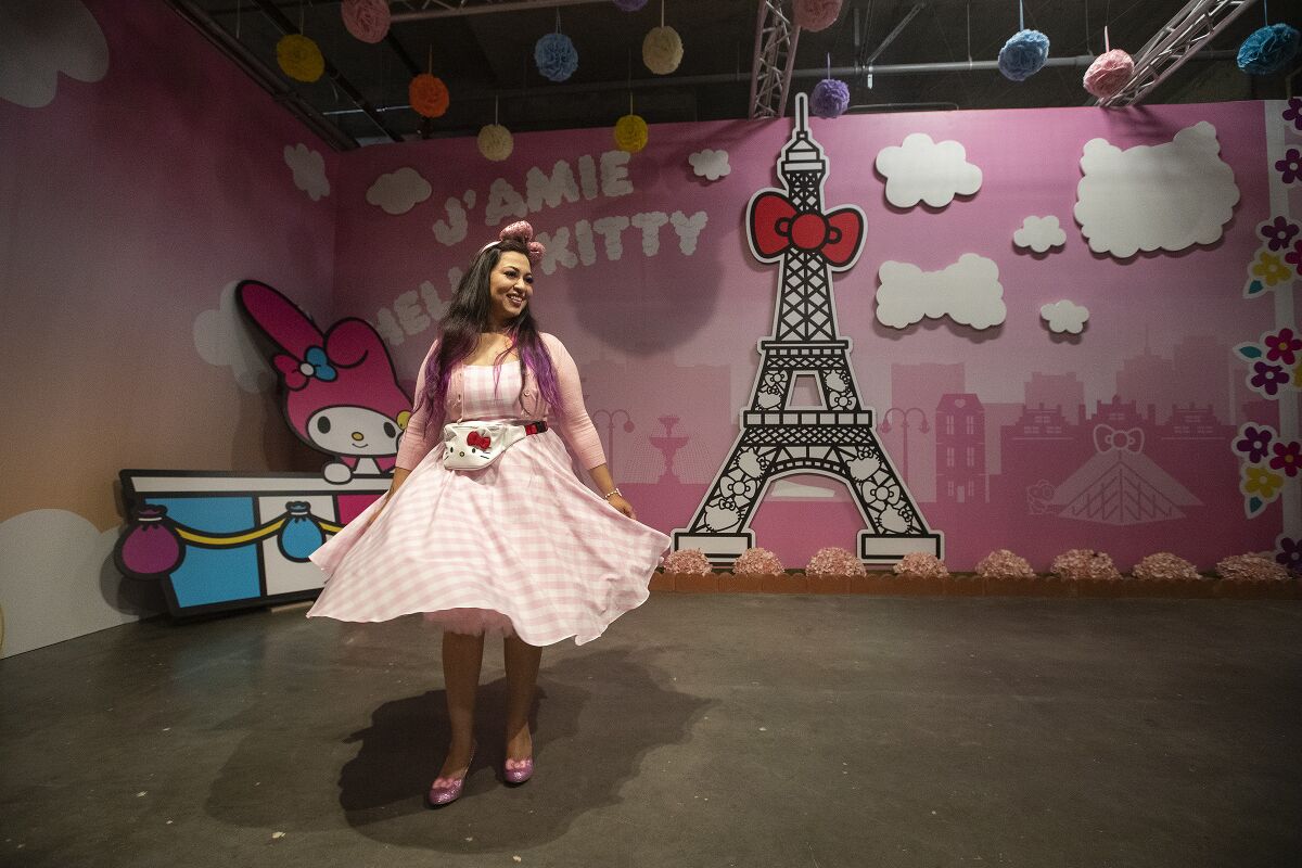 Faheema Chaudhury of Northridge goes for a spin inside the Paris room at the Hello Kitty Friends Around the World Tour pop-up.