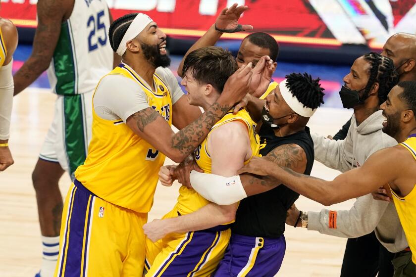 Los Angeles Lakers' Russell Westbrook (0), Anthony Davis, center left, Wayne Ellington.