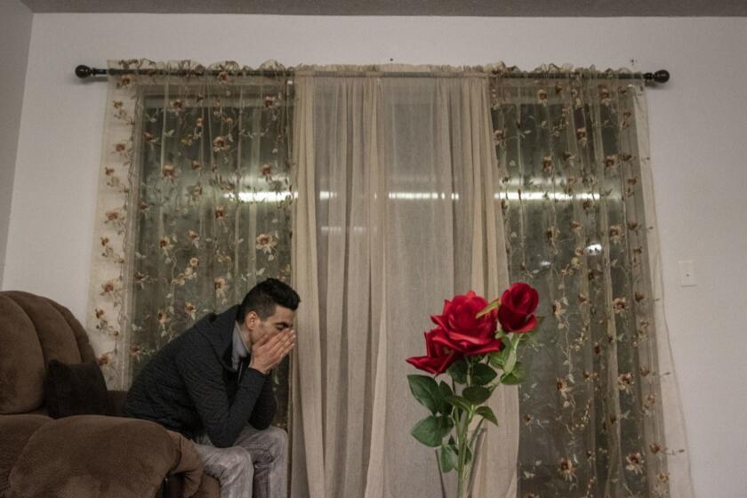 SEATTLE, WASH. -- WEDNESDAY, FEBRUARY 6, 2019: Iranian refugee Sirvan Moradi, 24, has a moment alone shortly after arriving on a log journey from Turkey to start a new life in Seattle, Wash., on Feb. 6, 2019. (Brian van der Brug / Los Angeles Times)