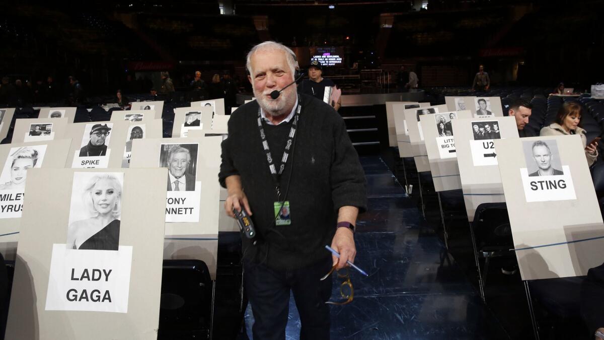 Executive producer Ken Ehrlich works during rehearsals for the 60th Grammy Awards.