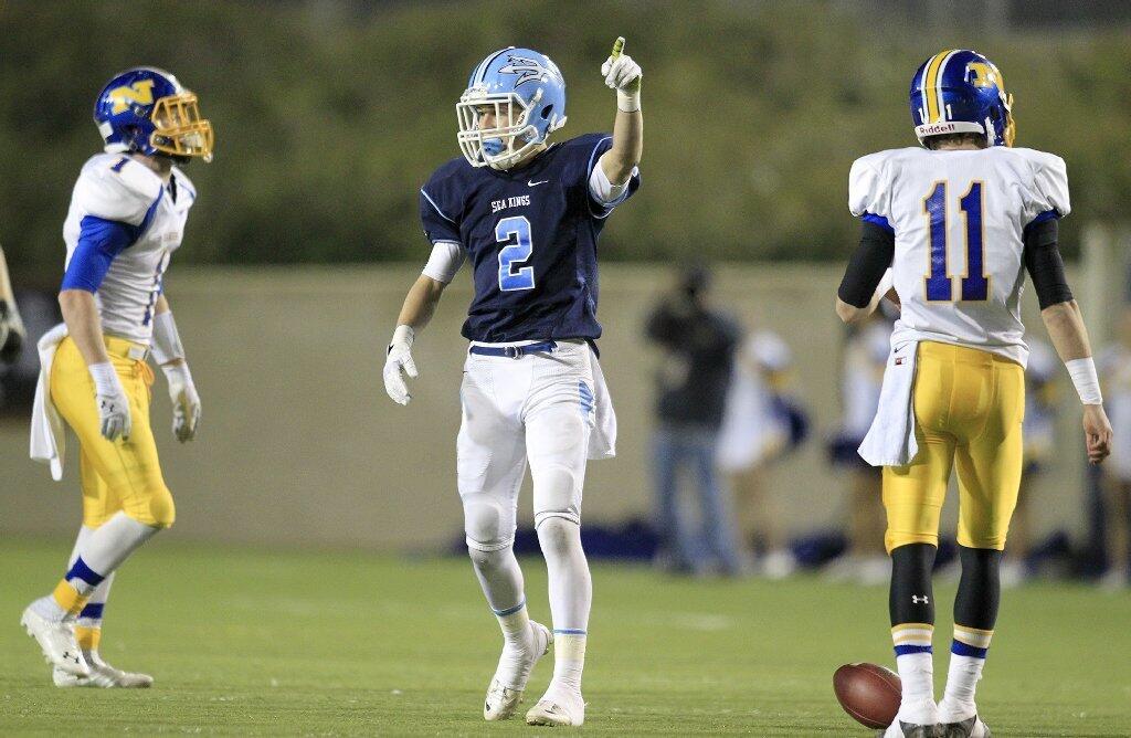 Corona del Mar High's Bo St. Geme (2) picks up a first down during the first half against Nordhoff in the CIF State Southern California Regional Division III Bowl Game at LeBard Stadium in Costa Mesa on Saturday.