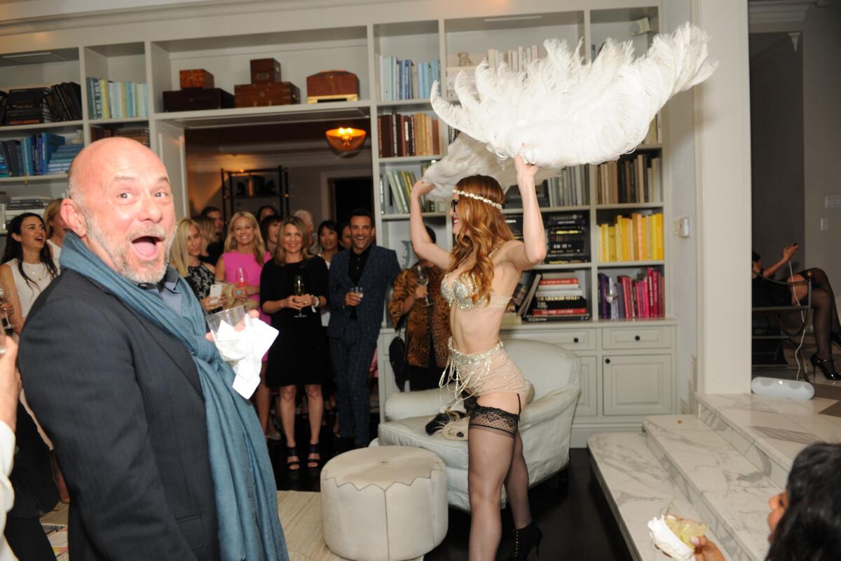 Eric Buterbaugh reacts as a dancer performs at Gwyneth Paltrow's party celebrating Windsor Smith's 'Homefront.'