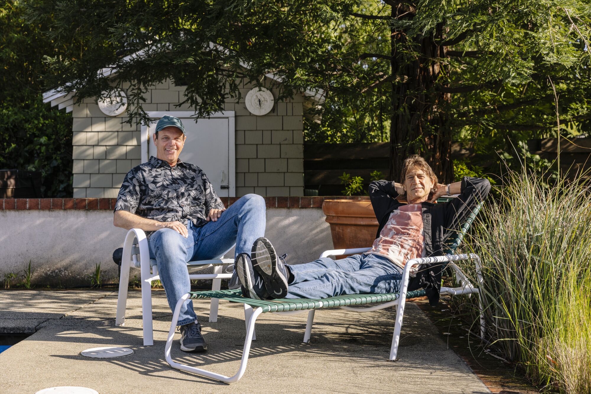 Dave Reddix and Steve Capper sit on lawnchairs