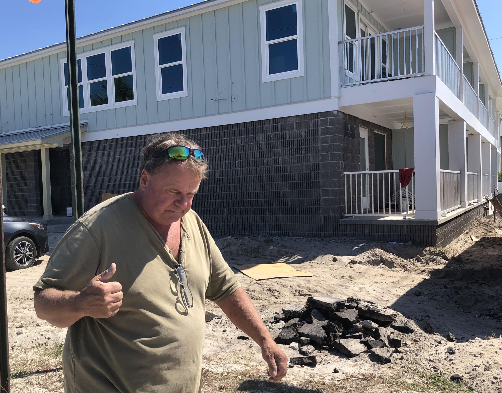 Charles "Chuck" Smith walks outside the new motel he is building in Mexico Beach.