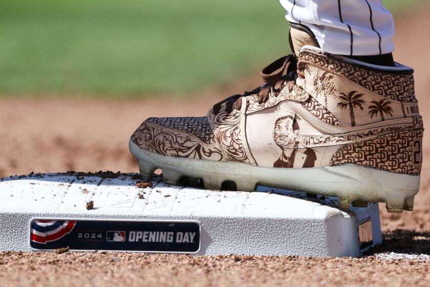 San Diego, CA - March 28: San Diego Padres right fielder Fernando Tatis Jr. (23) sports a pair of cleats in honor of Padres late owner Peter Seidler on Opening Day against the San Francisco Giants at Petco Park Thursday, March 28, 2024 in San Diego, CA. (Meg McLaughlin / The San Diego Union-Tribune)