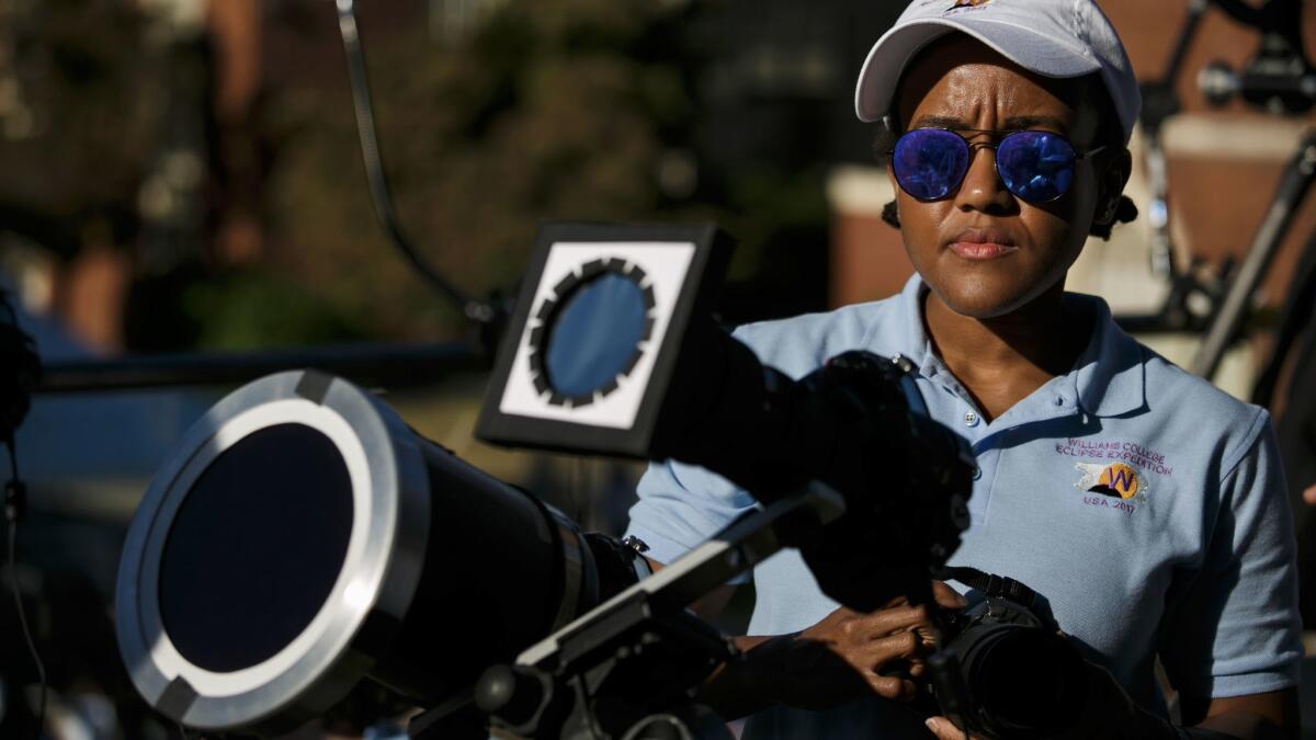 Amy Steele and other students document the solar eclipse in Salem, Ore.