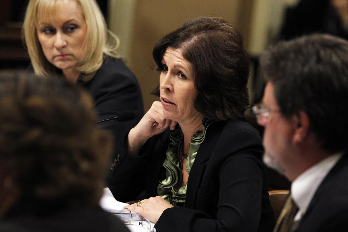Sharon Hilliard, center, chief deputy director at the Employment Development Department, speaks during an oversight committee hearing about delays in unemployment checks after a technology upgrade.