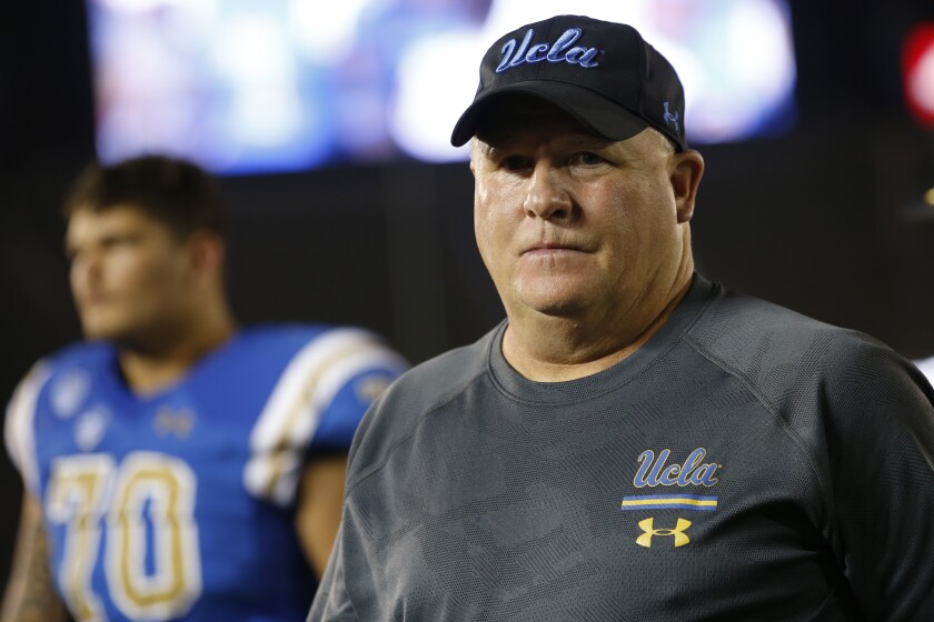 UCLA coach Chip Kelly walks off the field following the Bruins' 48-14 loss to Oklahoma at the Rose Bowl on Saturday.