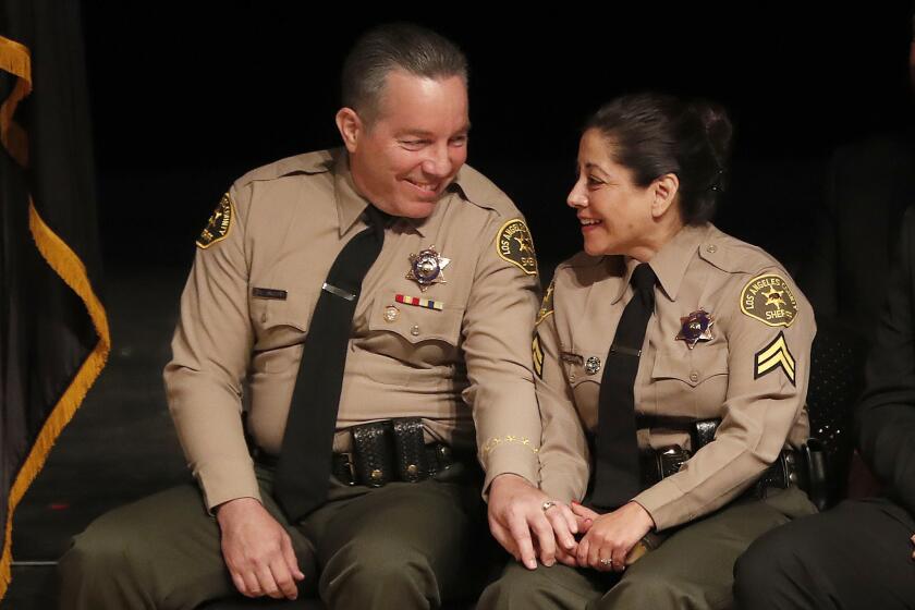 MONTEREY PARK, CA-DECEMBER 3, 2018: Alex Villanueva, the new Los Angeles County Sheriff, looks towards his wife Vivian, during his swearing in ceremony at East Los Angeles College in Monterey Park on December 3, 2018. Villanueva became the 33rd Sheriff of Los Angeles County. (Mel Melcon/Los Angeles Times)