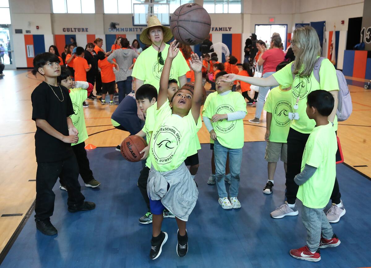 Participant Melody from Star View School puts up a shot in the free throw basketball event during Friday's event.