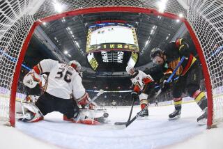 VANCOUVER, CANADA - NOVEMBER 28: Cam Fowler #4 looks on as John Gibson.