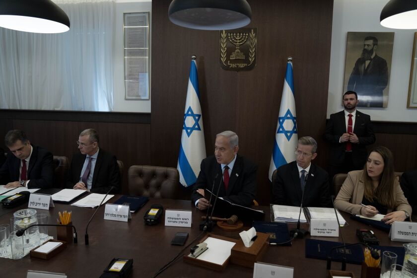 Israel's Prime Minister Benjamin Netanyahu, center, chairs the weekly cabinet meeting in Jerusalem, Sunday, Jan. 22, 2023. (AP Photo/Maya Alleruzzo, Pool)