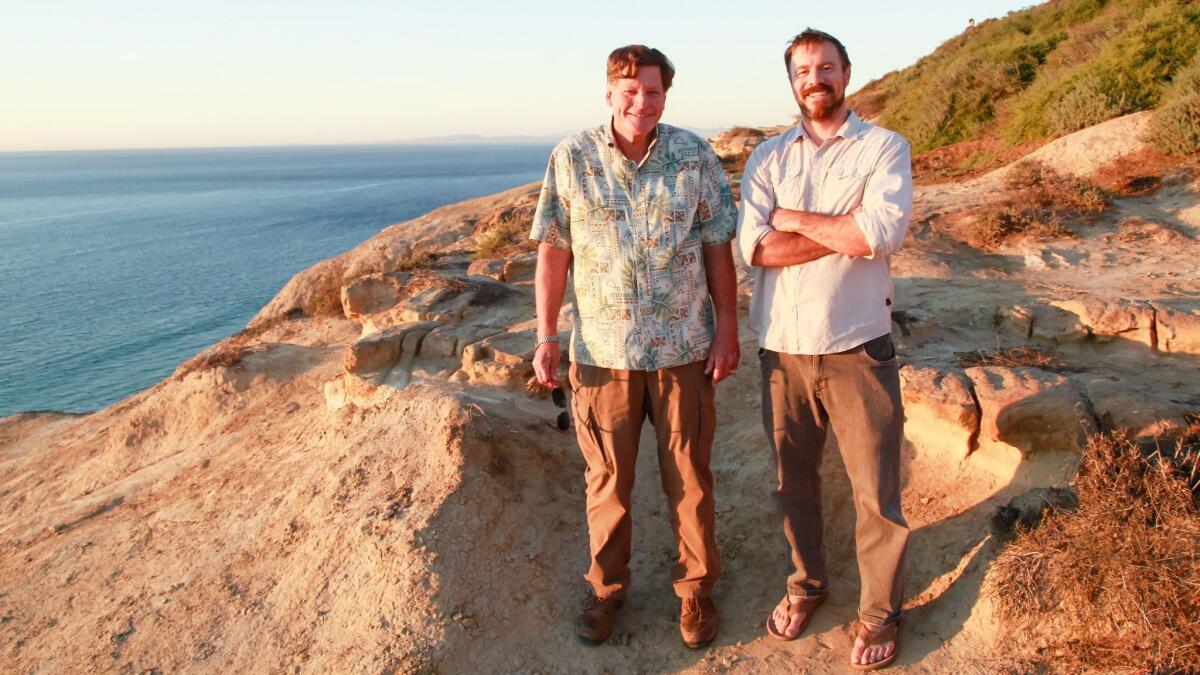 Ed Gillet, 67, and Dave Shiley, 37, at the Torrey Pines Glider Port in La Jolla on Wednesday. Shively has written "The Pacific Alone," a book about Gillet's legendary 64-day solo voyage by sea kayak from Monterey to Maui in 1987.