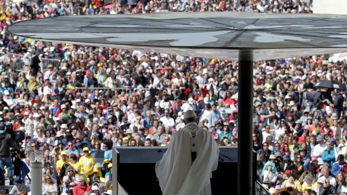 Pope Francis delivers his homily Saturday during Mass at the Sanctuary of Our Lady of Fatima.