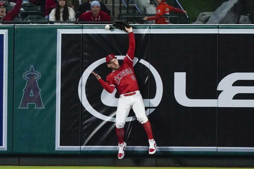 Los Angeles Angels left fielder Taylor Ward can't catch the ball on a double by Minnesota Twins.