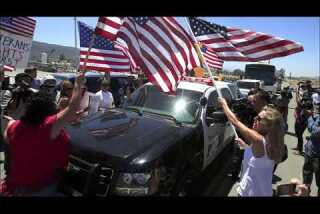 Protesters in Murrieta block busloads of detainees