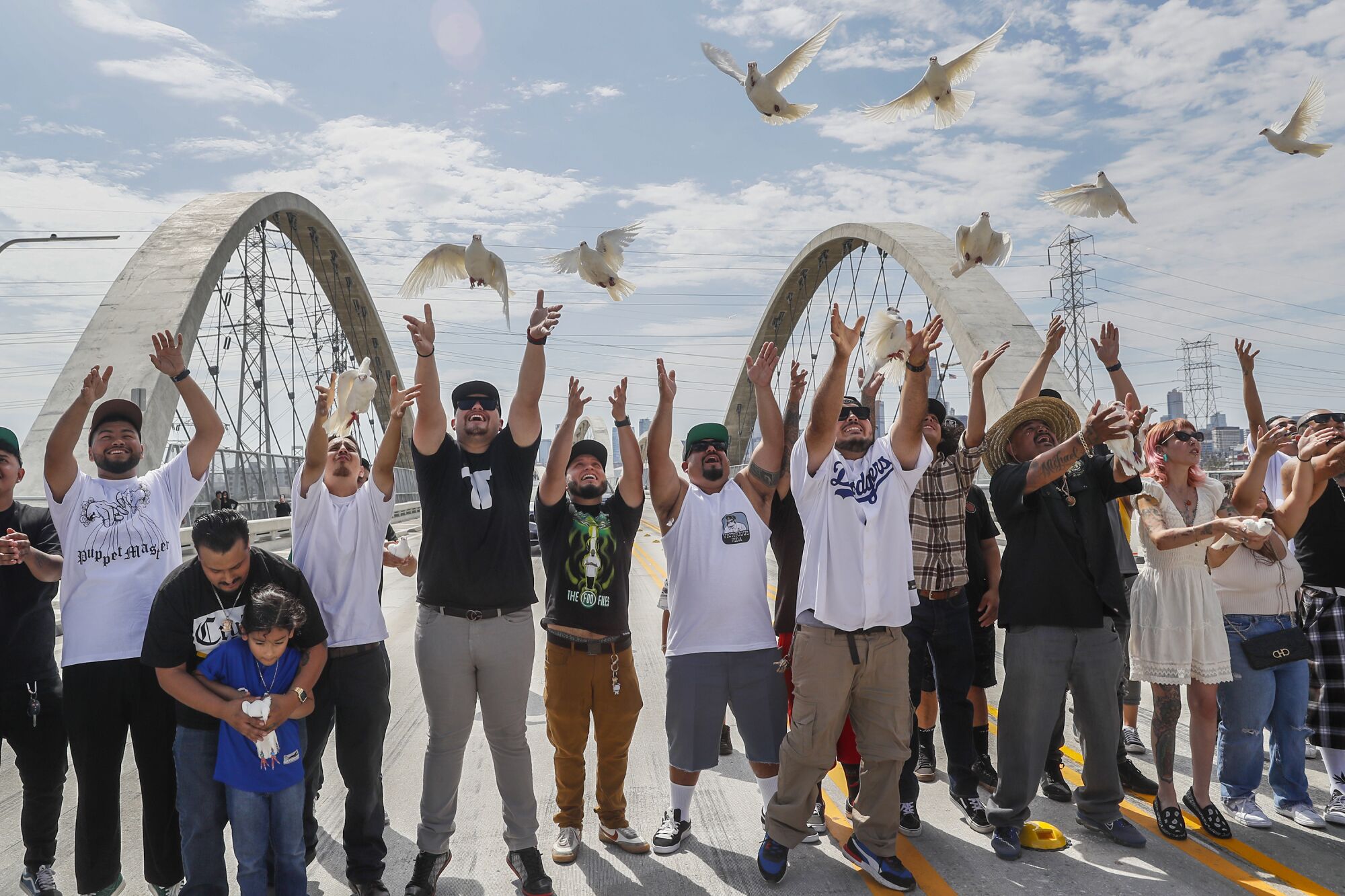 People release doves midspan to bless the 6th Street Viaduct