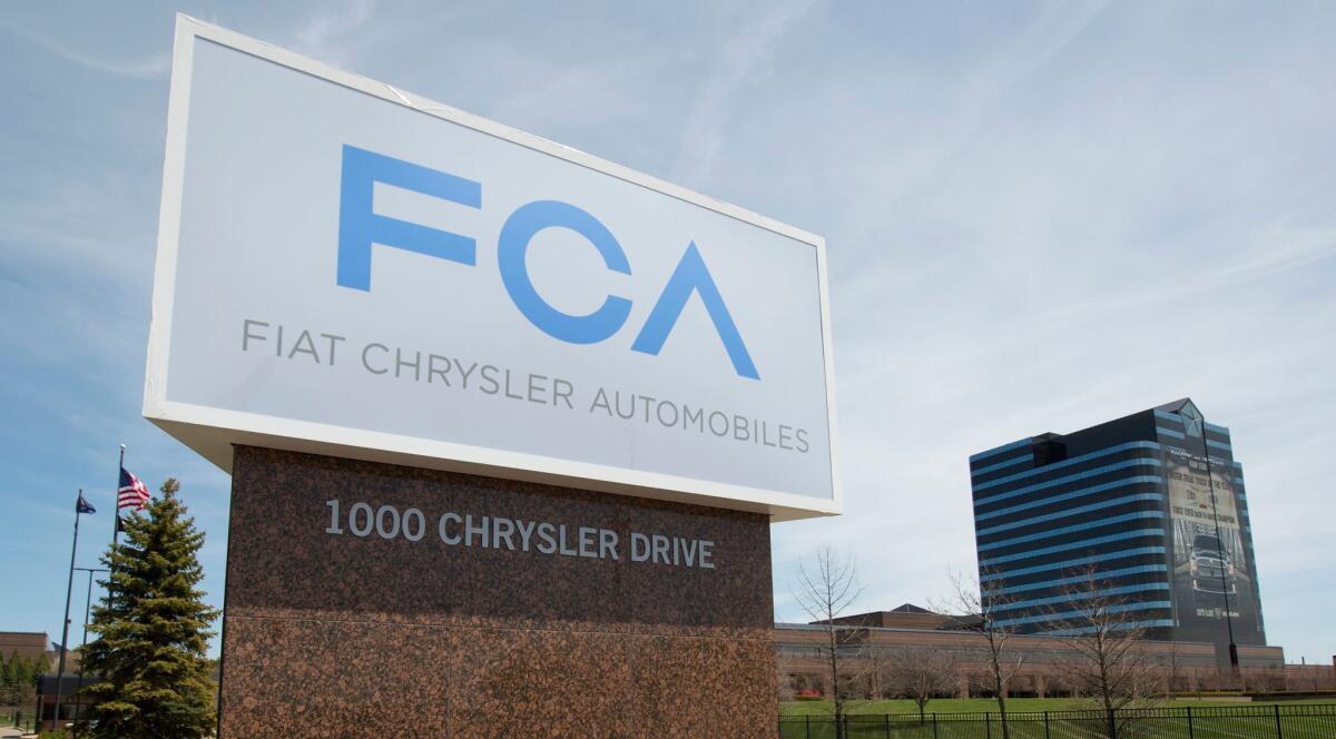 Fiat Chrysler Automobiles signage at the Chrysler Group World headquarters in Auburn Hills, Michigan. The Italy-based automaker proposed Monday to merge with French automaker Renault.